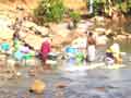 Washing in Gambia river 2
