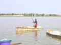 Collecting salt by canoe