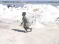 Child plays in salt